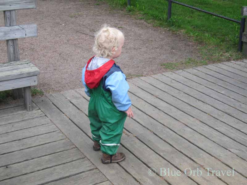 Child in Finland Decked Out in Christmas Colors